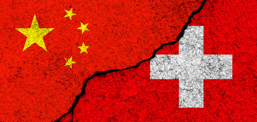 China and Switzerland. Flags background. Concept of politics, economy, culture and conflicts, war. Friendships and cooperation. Painted on concrete walls banner photo