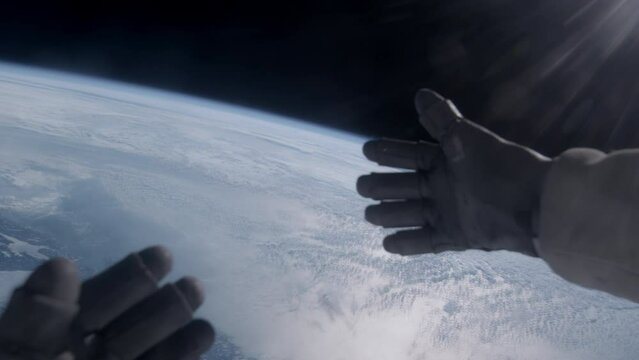 First person view of Earth through the astronaut helmet during the spacewalk