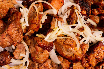 Fresh delicious hot kebab in a metal plate. Barbecue background.Pork kebab