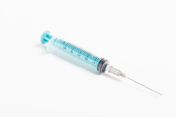 Medical syringe on a white background. A syringe for injection. The concept of health and beauty