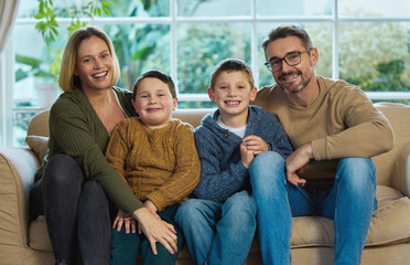 Your family are all you have. Shot of a family relaxing together in the living room.