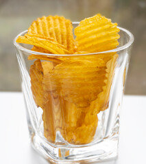 Heap of chips in blur. Chips are not sharp. Chips with bokeh effect on the edges