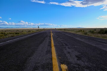 Empty two lane road in the desert.