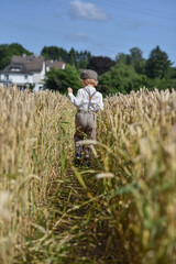 back view of a boy running in the field