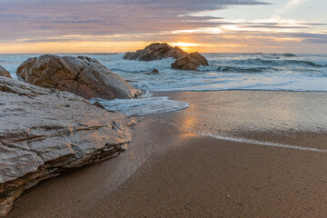 Atlantic ocean beach in the evening at sunset.