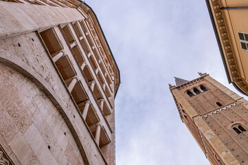 Fototapeta na wymiar Bottom view of the baptistery and bell tower of the cathedral of Parma, Italy