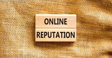 Online reputation symbol. Wooden blocks with concept words Online reputation on beautiful canvas...