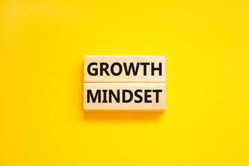 Growth mindset symbol. Wooden blocks with concept words Growth mindset on beautiful yellow background. Business growth mindset concept. Copy space.