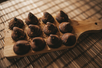 chocolate truffles on wooden background