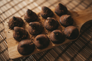 chocolate truffles on wooden background