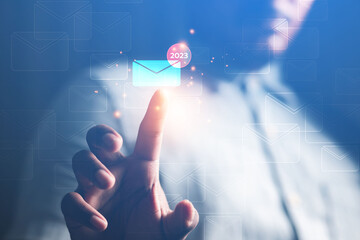 Male businessman touches email technology communication inbox online 2023 concept
