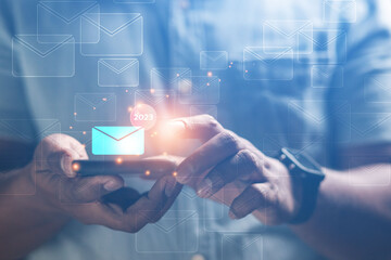 Male businessman touches email technology communication inbox online 2023 concept
