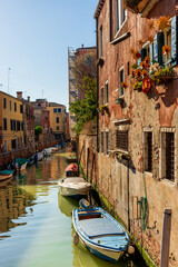 Morning in Venice, water channels along residential buildings, cityscape
