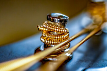 Macro of a Guitar String Wound Around a Tuning Peg