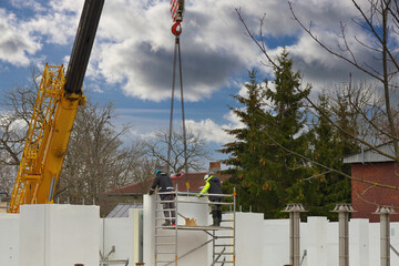 Installation of a panel house with a crane. Construction new and modern modular house from...