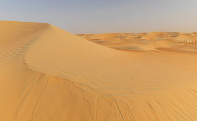 Fototapeta na wymiar Dunes and colored sands of the Rub al-Khali desert