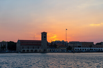 View of the entrance to the port on the island of Rhodes in Greece at sunset