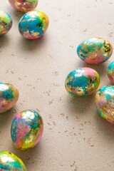 Handmade colorful easter eggs on light background. Minimal easter concept. Copy space for text. Selective focus.