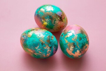 Easter colorful eggs on pink background. Easter card. Selective focus.