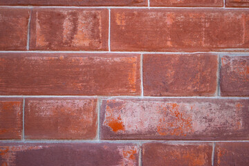 brick wall with scuffs out of focus
