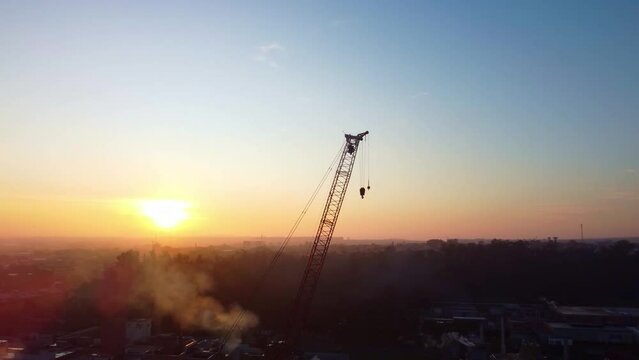 scene showing a manitowoc crane at Nestle Industrial Park with beautiful sky in Brazil, 4k, drone scene.