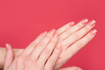 closeup of female hands with manicure and smooth skin