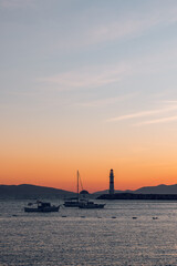 Fototapeta na wymiar Turgutreis lighthouse at sunset in bodrum Turkey