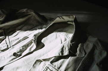 White jacket lying on the bed