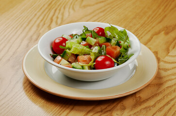 Light vegetable salad with cucumbers, lettuce, cucumbers