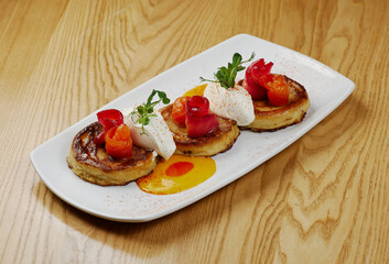 pancakes with cheese, sauce and fish salmon and tuna