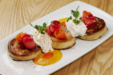 pancakes with cheese, sauce and fish salmon and tuna