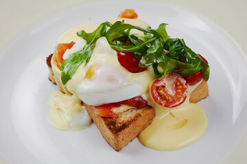 delicious breakfast sandwich with ham and salmon, cheese, egg, vegetables