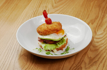 fried sandwich with bacon, vegetables and meat