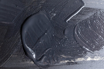 Detalle de fondo texturizado grunge de pintura negra sobre madera