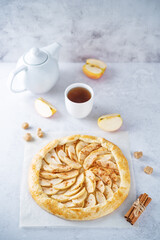 Apple galette on a paper sheet