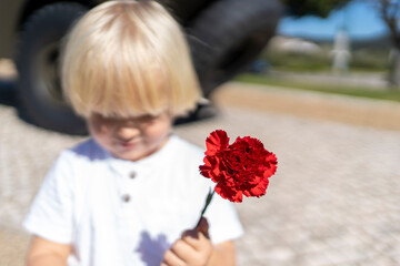 25 of April, celebration of 50 Years, Portugal freedom day. Revolution of the Carnations 1974. Kid...