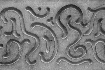 Abstract decorative pattern on the gray facade of the house
