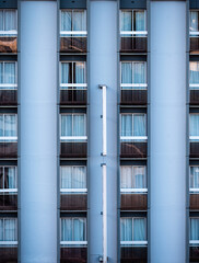 Generic facade of an apartment building with many windows