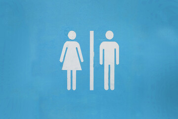 WC toilet sign with men and women icons printed over yellow background	
