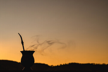Chimarrão gourd at sunset, yerba mate infusion, served on cold winter days, gauchá tradition,...