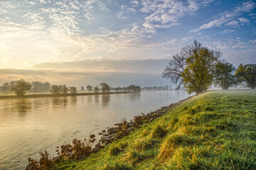 The river danube between the rural towns Osterhofen and Winzer in lower bavaria during sunrise in...