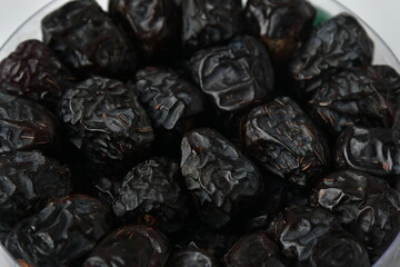 Arabic dates, ajwa dates on the white
