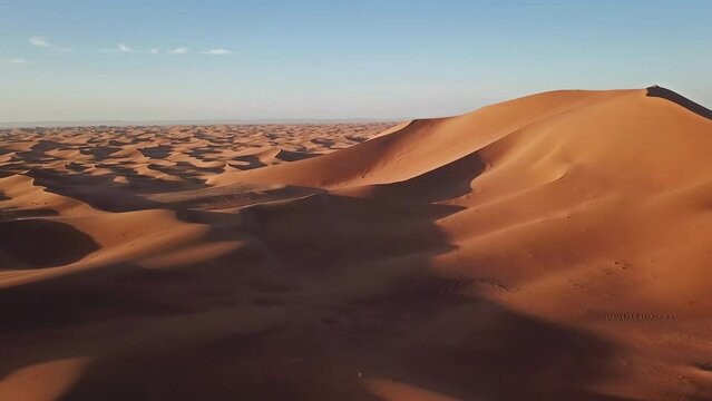 Aerial view on big sand dunes in Sahara desert at sunrise, Africa, 4k