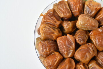 Arabic dates, sugary dates on the white
