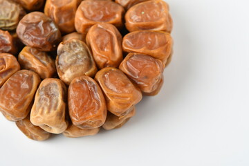 Arabic dates, sugary dates on the white
