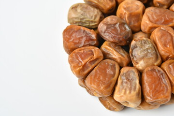 Arabic dates, sugary dates on the white
