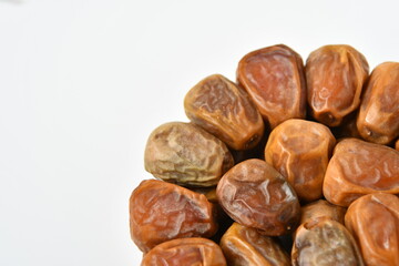 Arabic dates, sugary dates on the white
