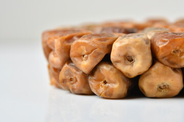 Arabic dates, sugary dates on the white
