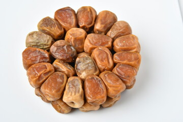 Arabic dates, sugary dates on the white
