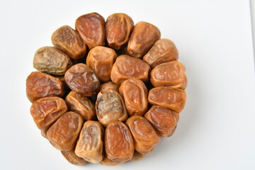 Arabic dates, sugary dates on the white

